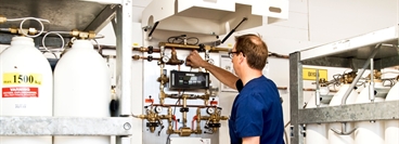 A hospital technician operating central gas system in REMEO Stockholm.