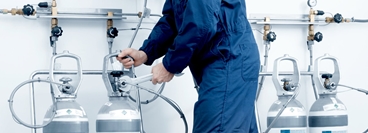 Service technician at oxygen cylinder storage