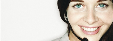 Smilling woman with headset, Portrait.