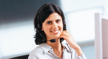 Woman with telephone and computer in the office